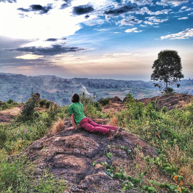 Man doing yoga in beautiful environment in Kapchorwa, Mount Elgon, Uganda