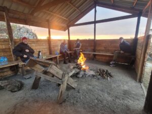 Hikers around bonfire at Mount Elgon